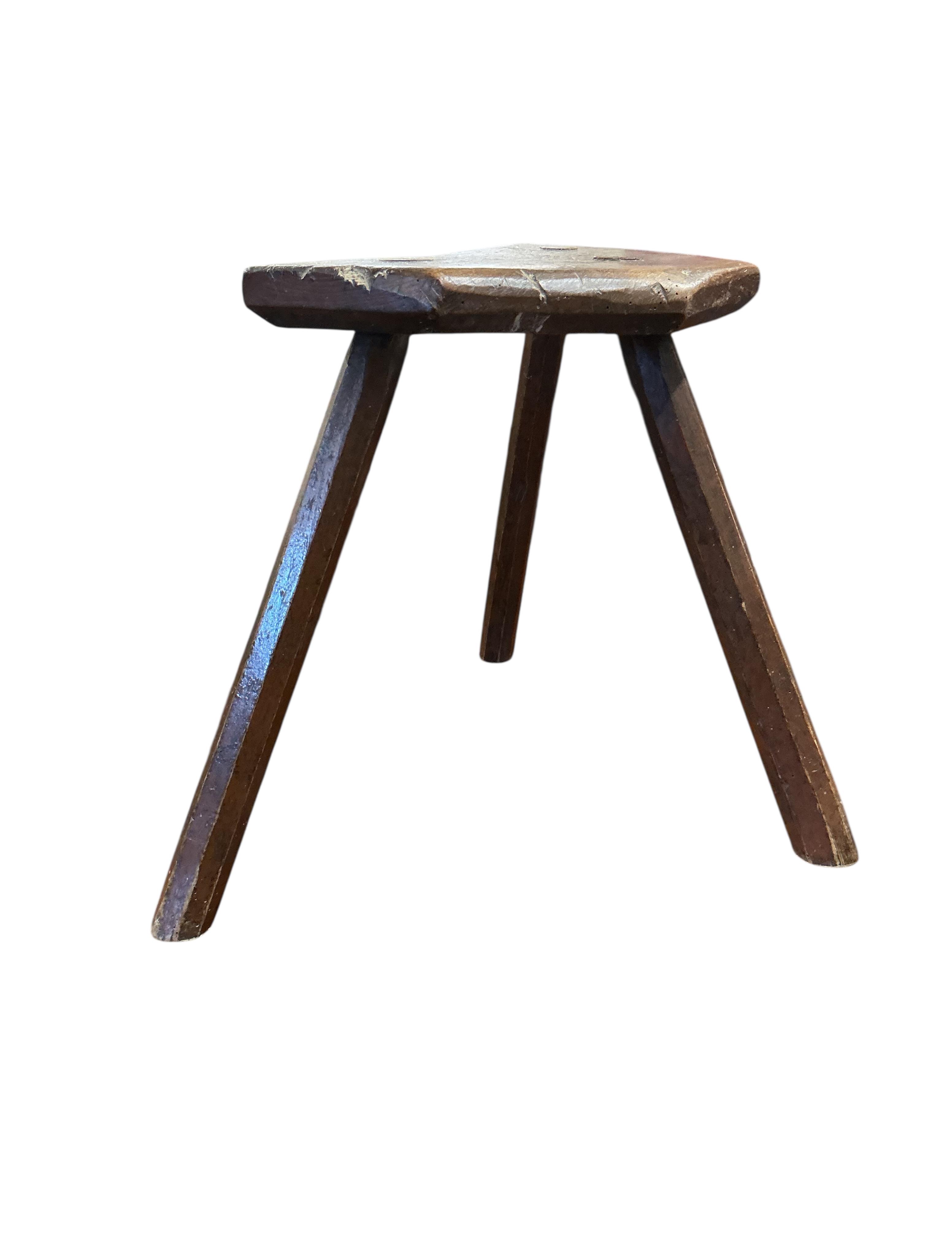 A 19th century elm and beech Provincial three legged stool, width 39cm, depth 23cm, height 40cm